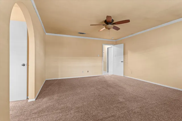 a white toilet sitting next to a bath tub