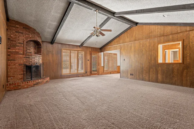 a large white kitchen with a sink and cabinets