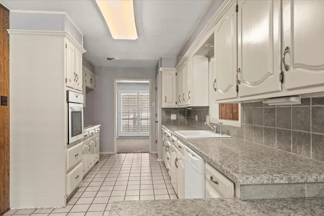 a view of a livingroom with a kitchen