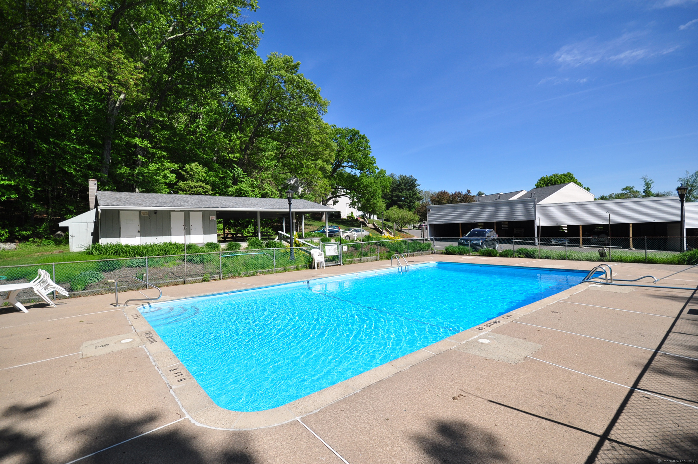 305 Timber Lane, Unit 305 Canton, CT 06019 - Photo 2 of 39 a view of a house with swimming pool