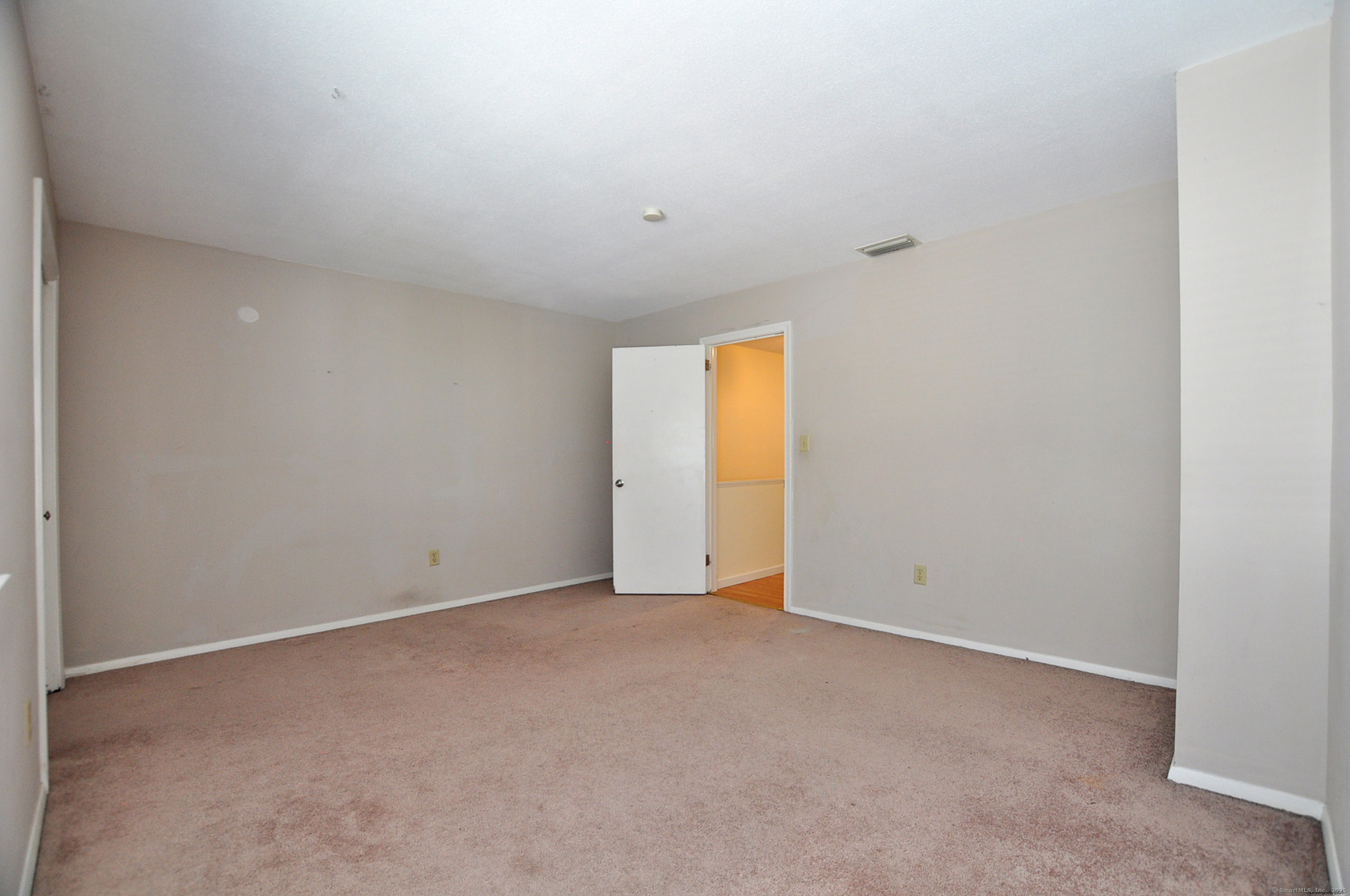 305 Timber Lane, Unit 305 Canton, CT 06019 - Photo 23 of 39 a view of an empty room with a closet