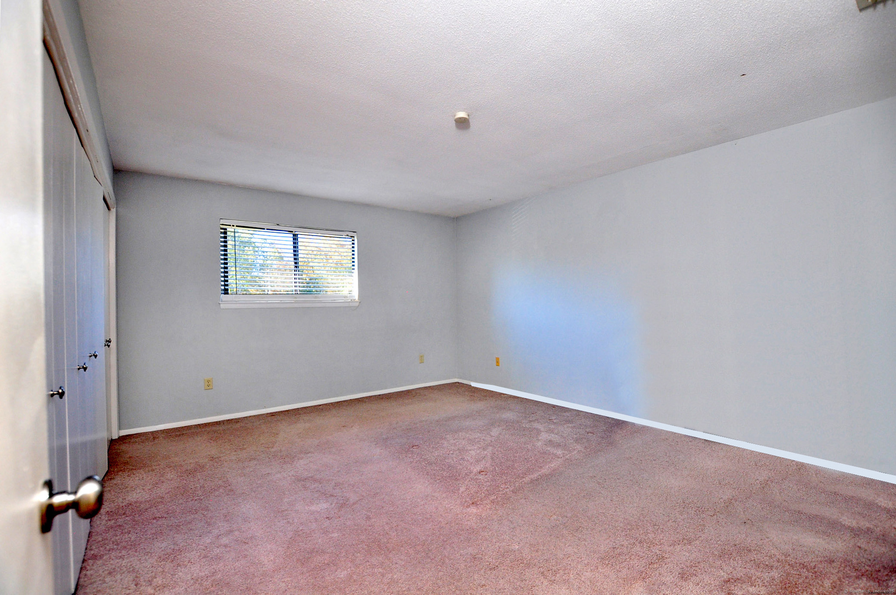 305 Timber Lane, Unit 305 Canton, CT 06019 - Photo 27 of 39 an empty room with windows
