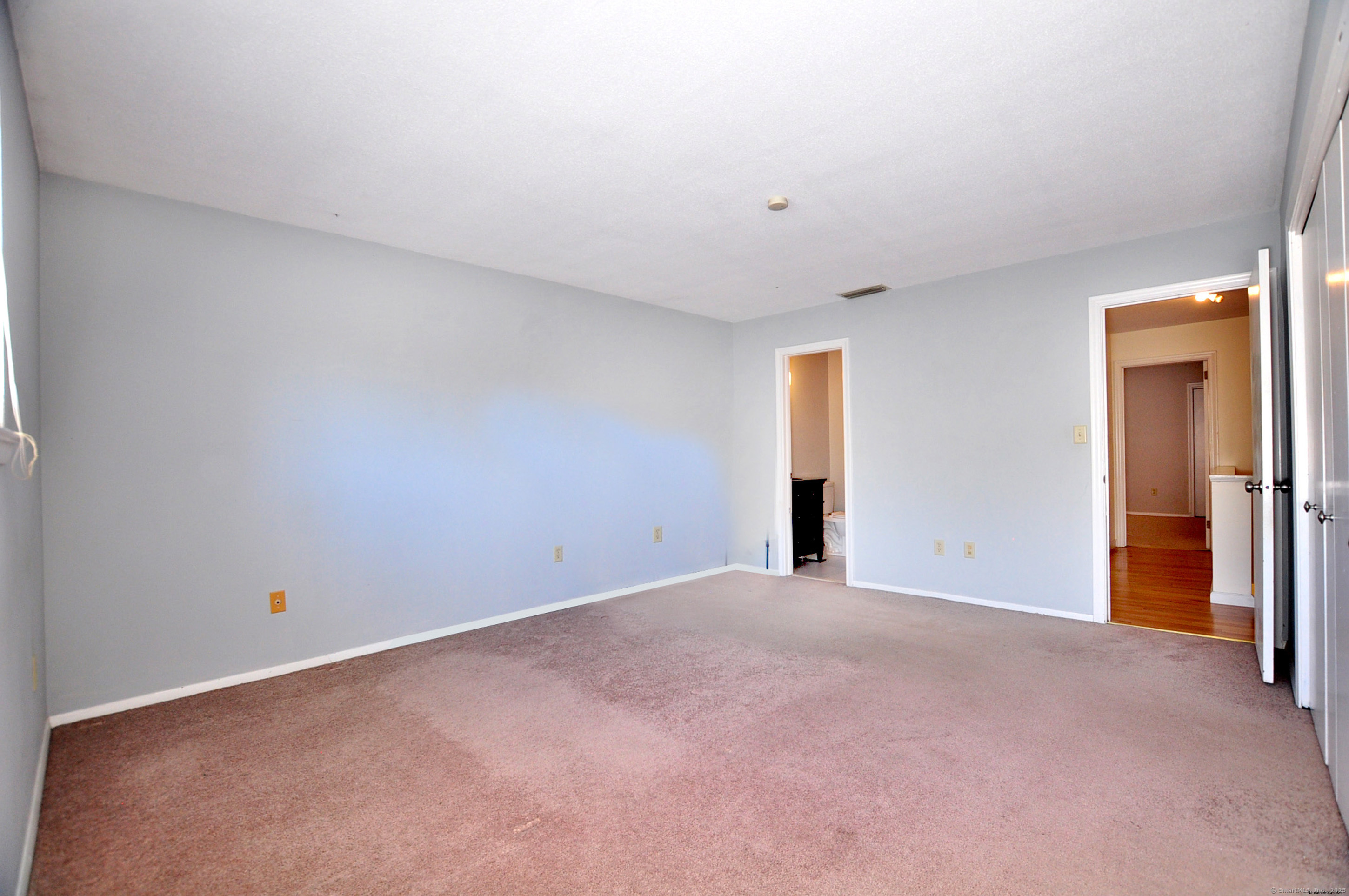 305 Timber Lane, Unit 305 Canton, CT 06019 - Photo 28 of 39 a view of an empty room with a window
