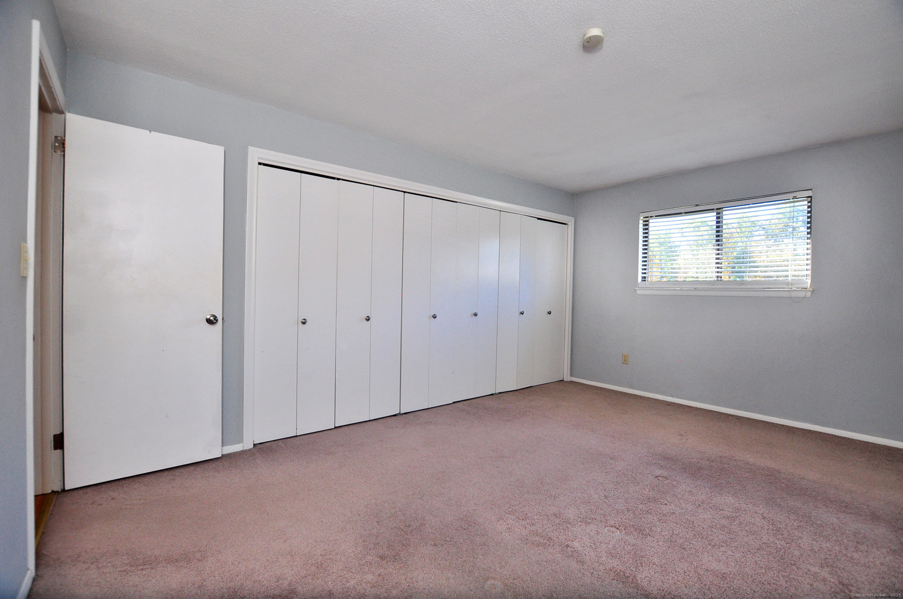 305 Timber Lane, Unit 305 Canton, CT 06019 - Photo 31 of 39 a view of an empty room with a window