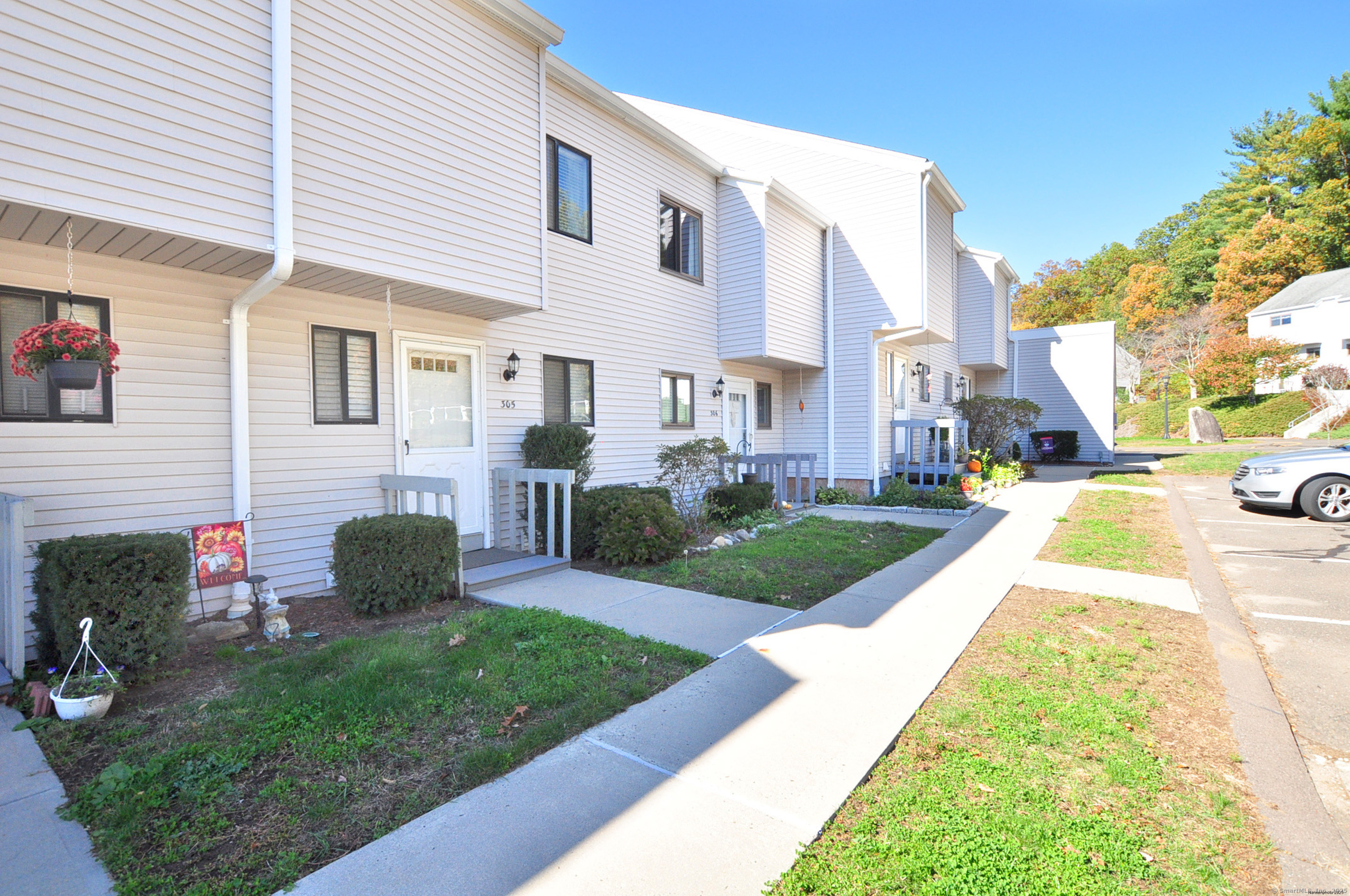 305 Timber Lane, Unit 305 Canton, CT 06019 - Photo 36 of 39 a view of a house with a yard