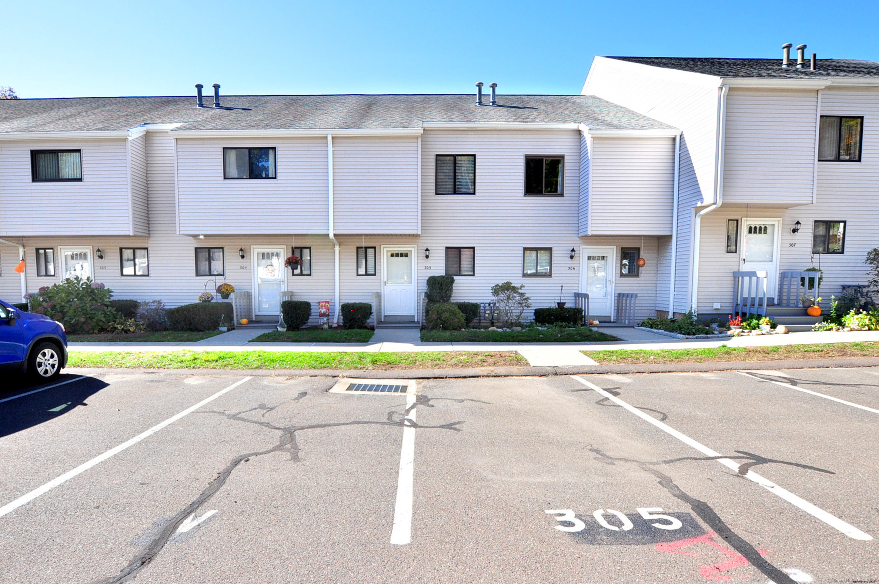 305 Timber Lane, Unit 305 Canton, CT 06019 - Photo 37 of 39 a view of front of house with a yard