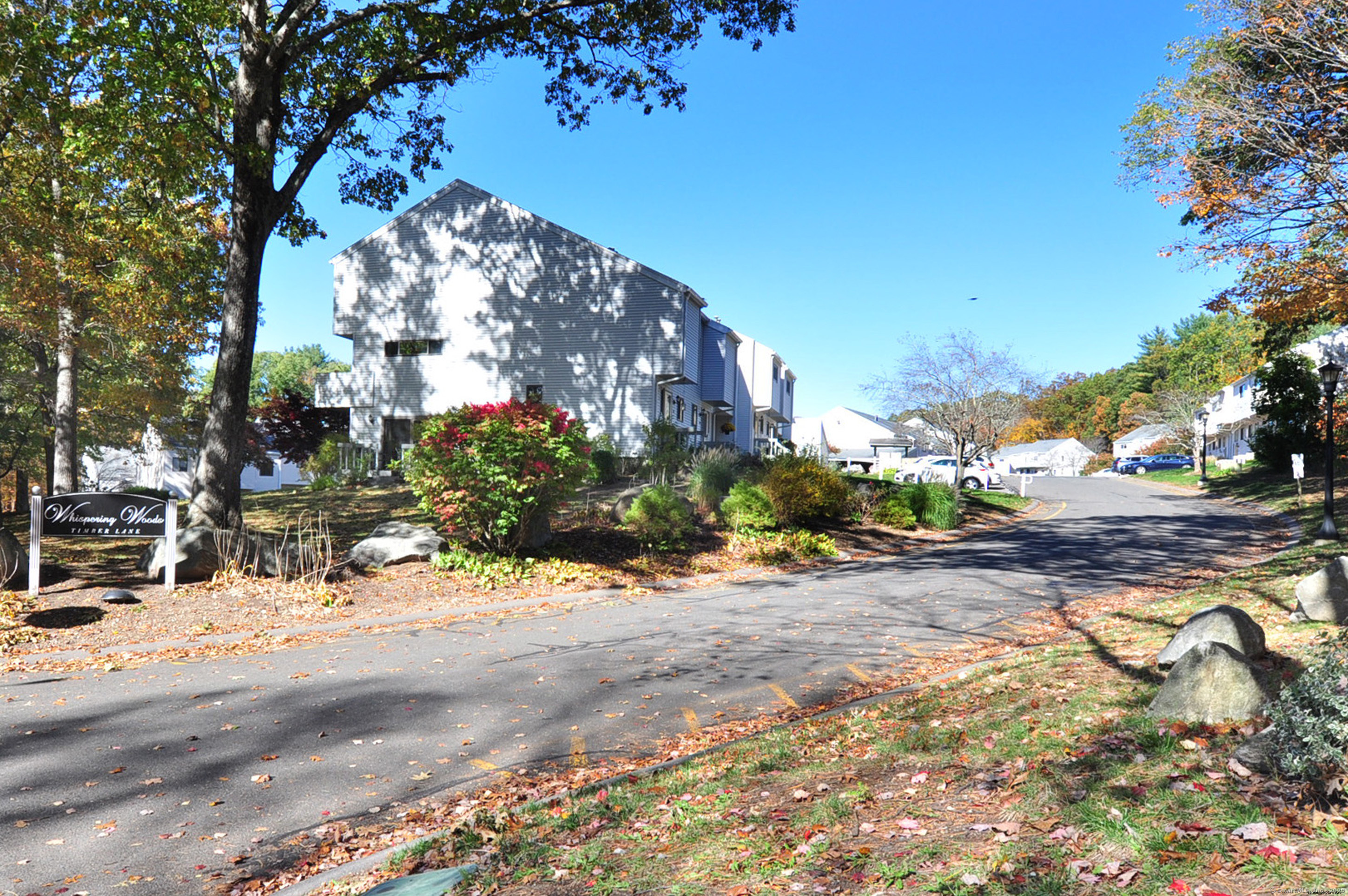 305 Timber Lane, Unit 305 Canton, CT 06019 - Photo 38 of 39 a view of a street with houses