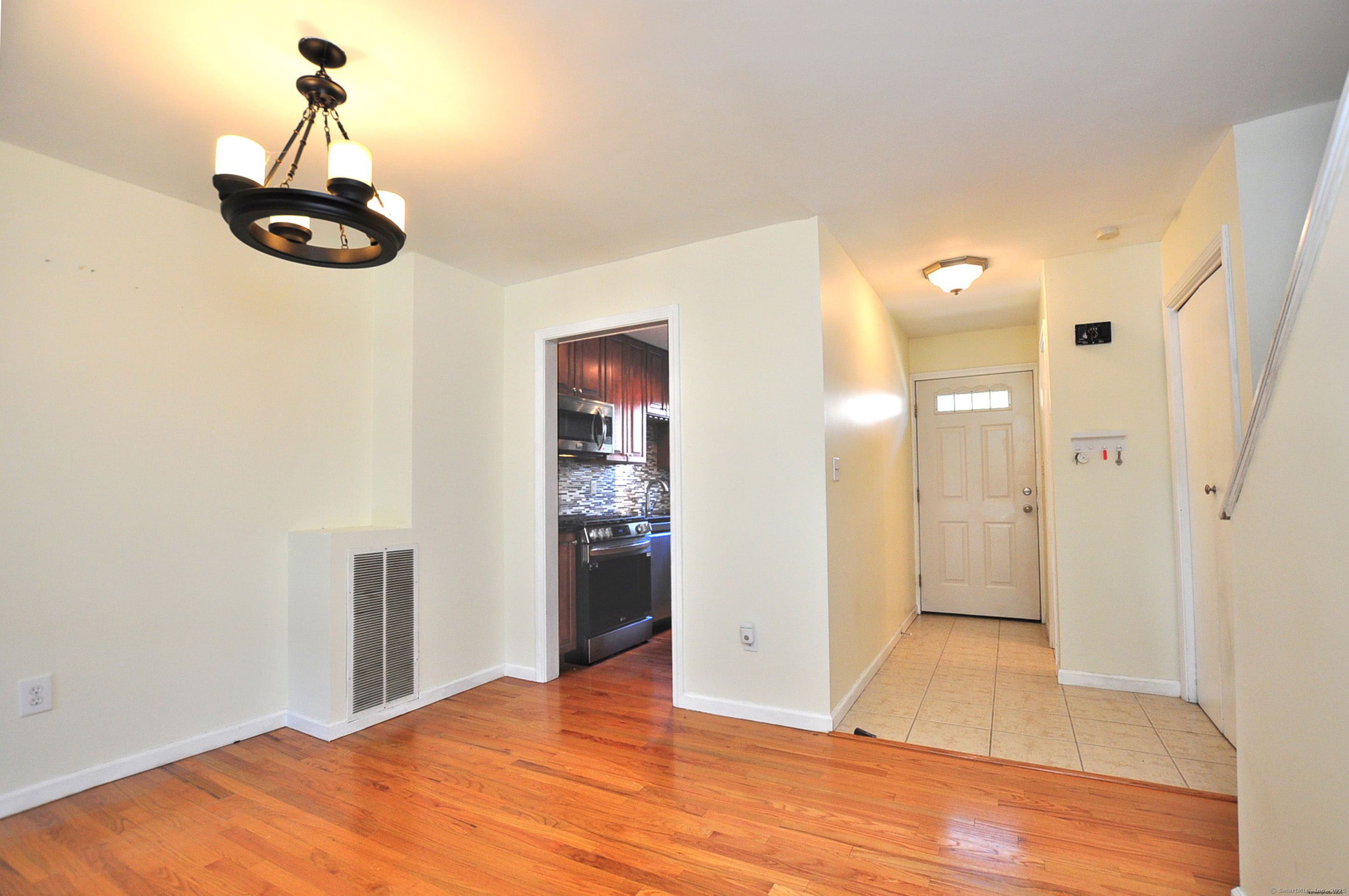 305 Timber Lane, Unit 305 Canton, CT 06019 - Photo 7 of 39 a view of empty room with wooden floor