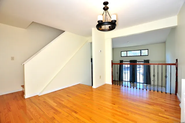a view of a hall with wooden floor