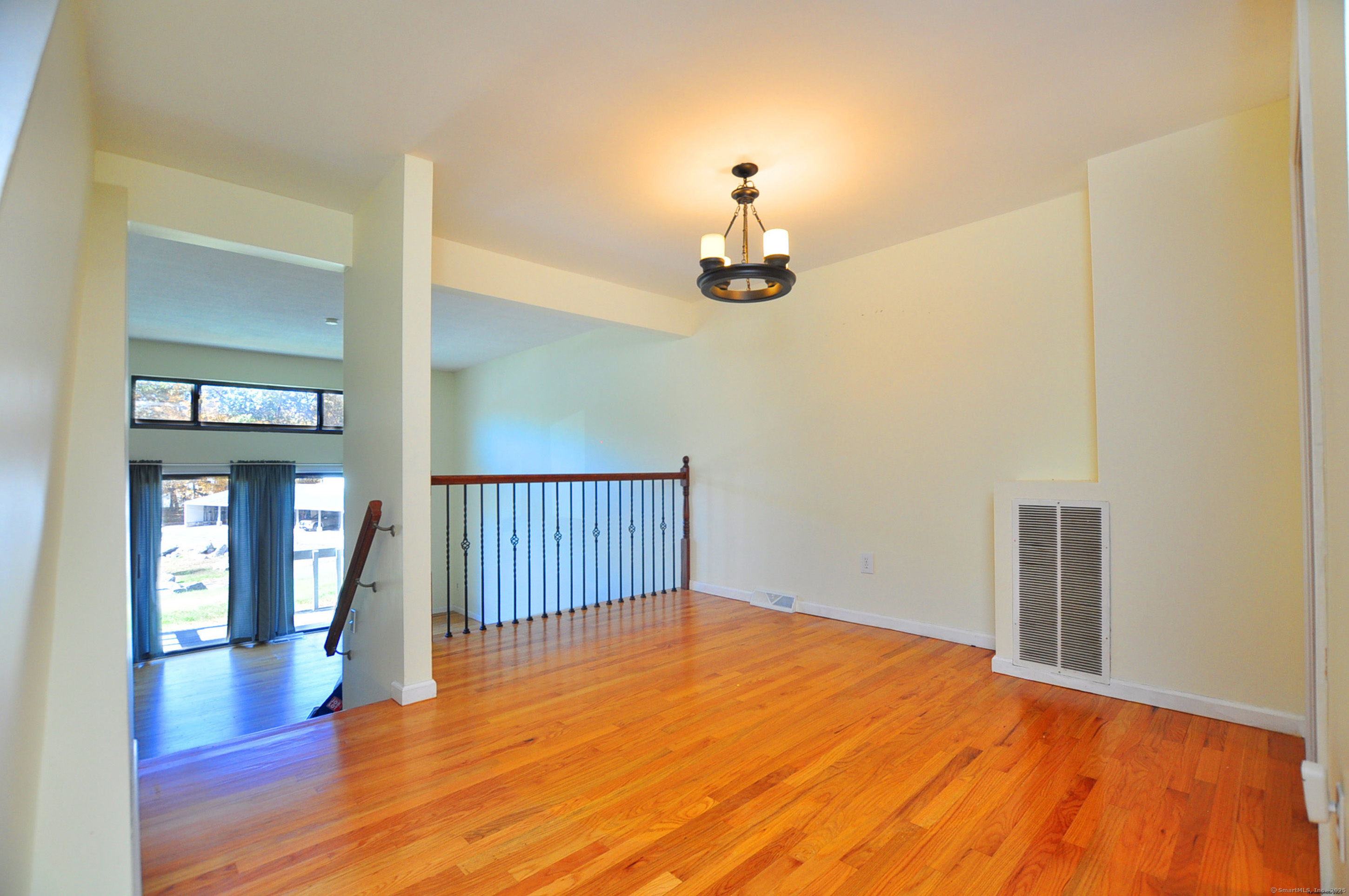 305 Timber Lane, Unit 305 Canton, CT 06019 - Photo 10 of 39 a view of empty room with wooden floor