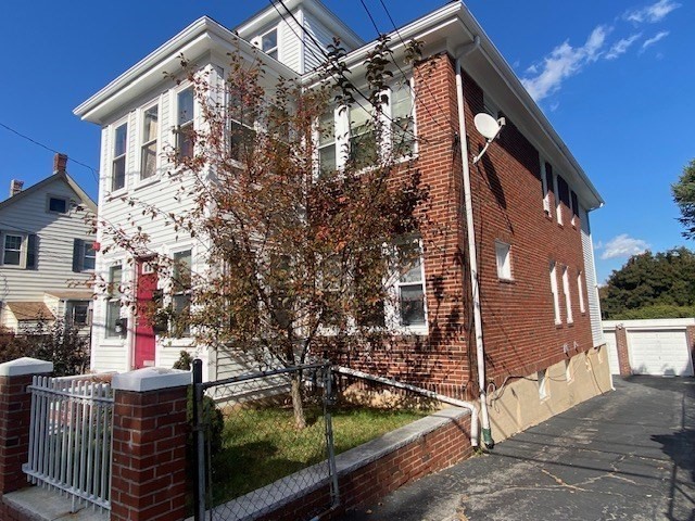 a view of a house with a tree