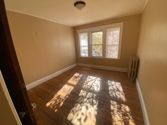 123 Glendower Road, Unit 1 Boston, MA 02131 - Photo 4 of 11 a view of empty room with wooden floor