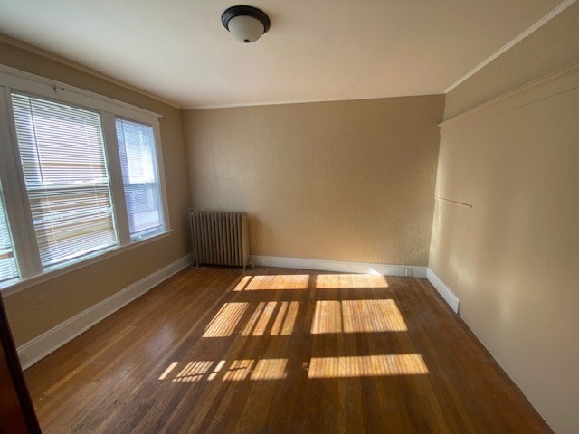 123 Glendower Road, Unit 1 Boston, MA 02131 - Photo 6 of 11 an empty room with windows
