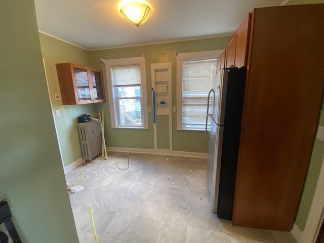 123 Glendower Road, Unit 1 Boston, MA 02131 - Photo 9 of 11 a view of an empty room with a fireplace and a window