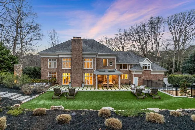 a view of swimming pool with two potted plants