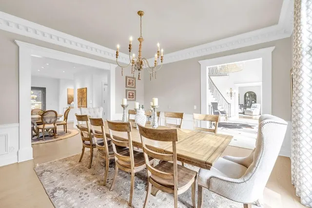 a large kitchen with stainless steel appliances kitchen island granite countertop a large counter top a sink and stainless steel appliances