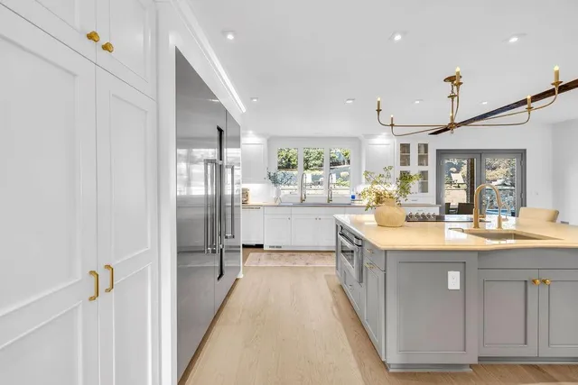 a bathroom with a sink a mirror and a toilet