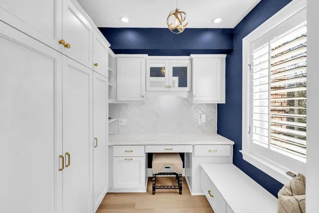 a bath tub sitting in a bathroom next to a window