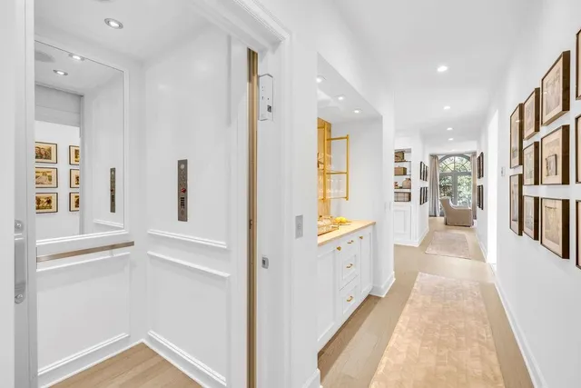 a kitchen with a sink refrigerator and cabinets