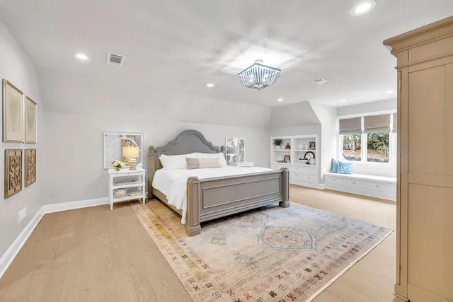a view of a house with pool bath tub and wooden fence