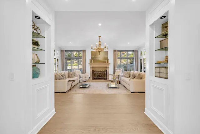 a living room with furniture fireplace and flat screen tv