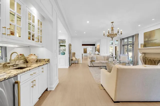 a view of a dining room with furniture and chandelier
