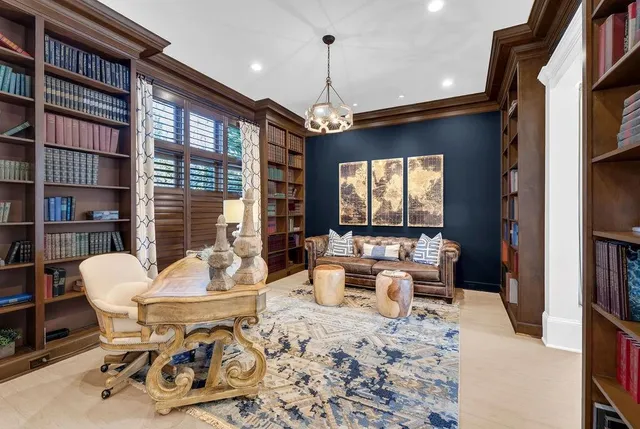 a living room with dining table and chairs