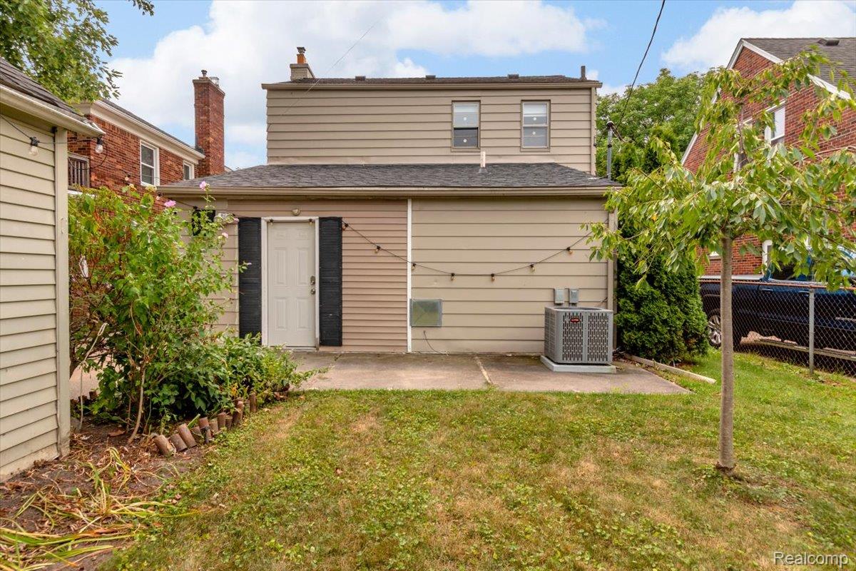 476 Touraine Road Grosse Pointe, MI 48236 - Photo 28 of 30 Patio with a concrete slab, exterior door, and an air conditioning unit