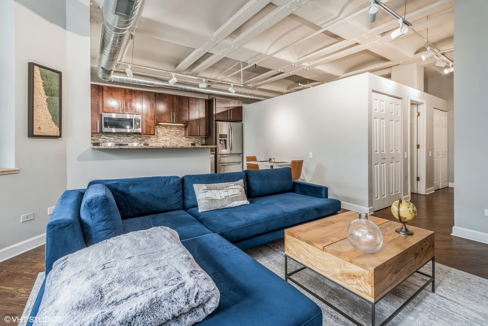 500 South Clinton Street, Unit 403 Chicago, IL 60607 - Photo 3 of 13 a living room with furniture and a table