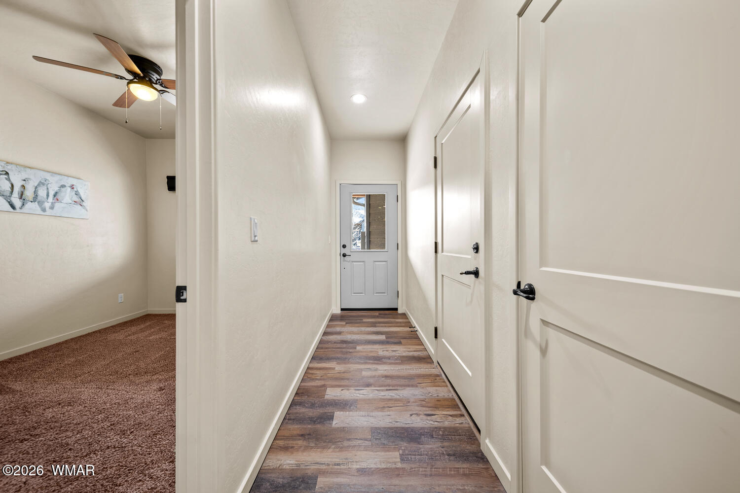 5859 Apollo Way Lakeside, AZ 85929 - Photo 12 of 35 a view of a hallway with wooden floor