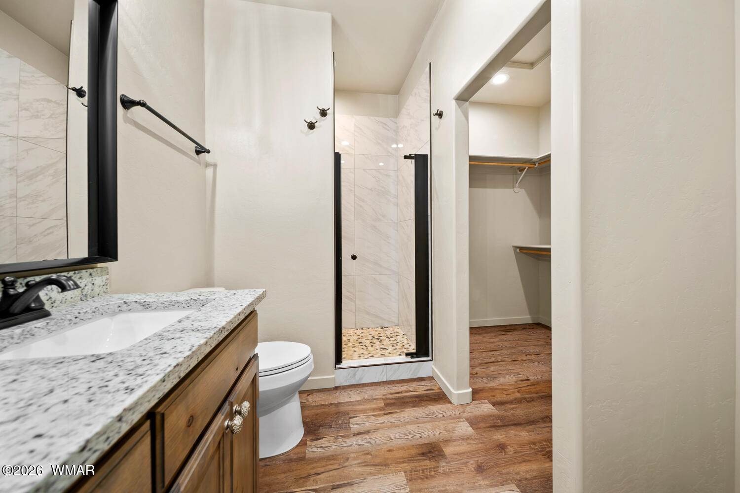 5859 Apollo Way Lakeside, AZ 85929 - Photo 17 of 35 a bathroom with a granite countertop sink toilet and shower