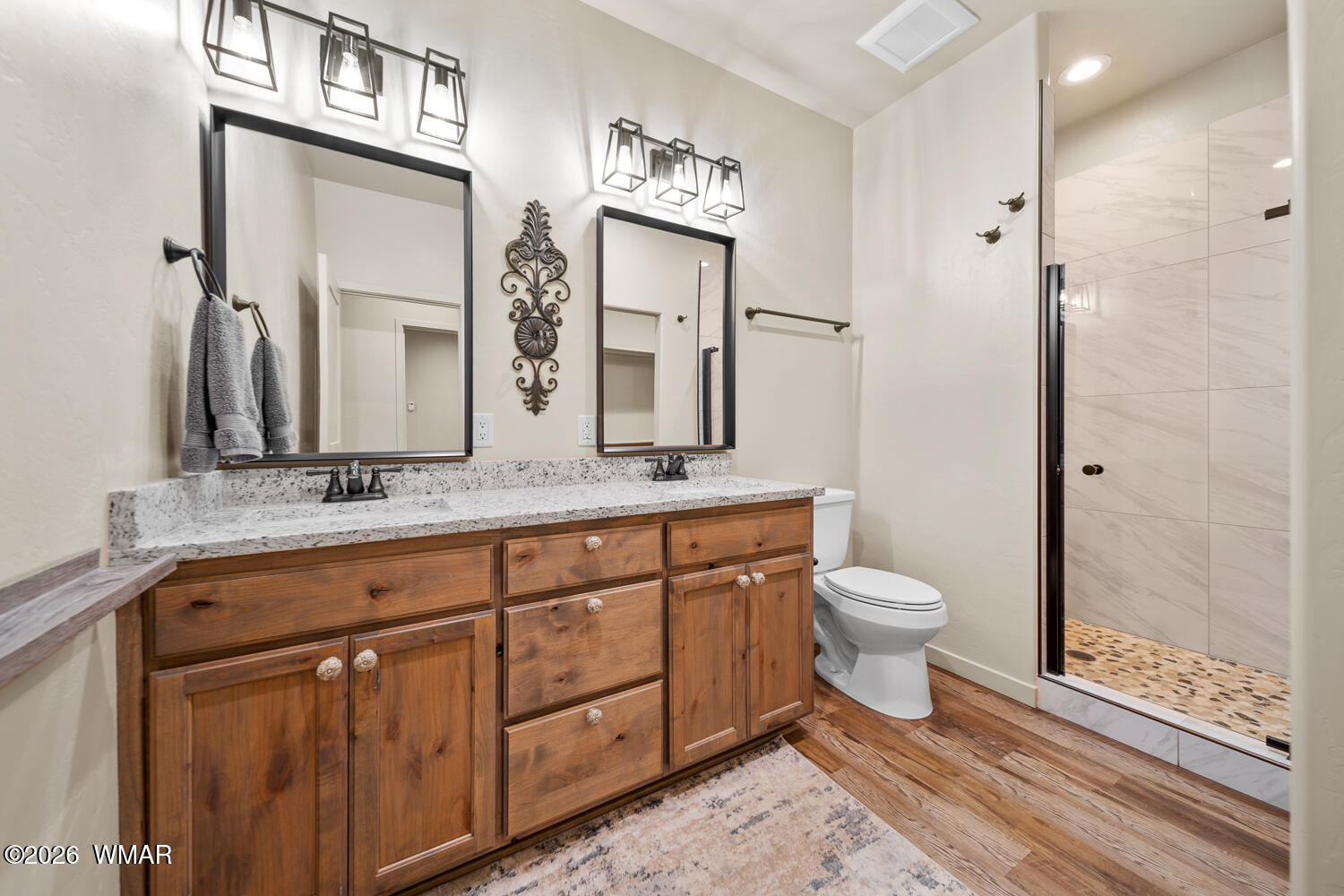 5859 Apollo Way Lakeside, AZ 85929 - Photo 18 of 35 a bathroom with a toilet sink and mirror