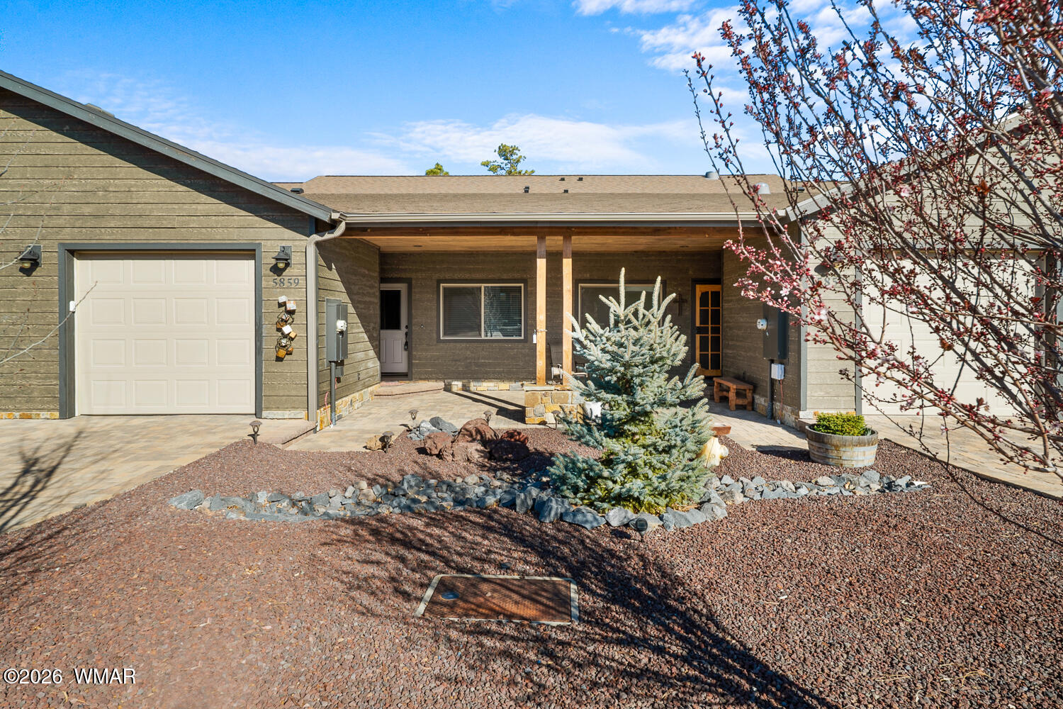 5859 Apollo Way Lakeside, AZ 85929 - Photo 26 of 35 a front view of a house with garden