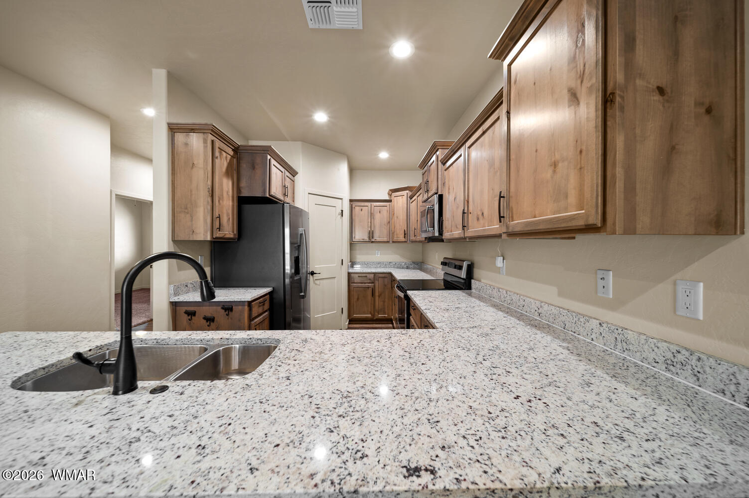 5859 Apollo Way Lakeside, AZ 85929 - Photo 8 of 35 a kitchen with granite countertop a sink stainless steel appliances and cabinets