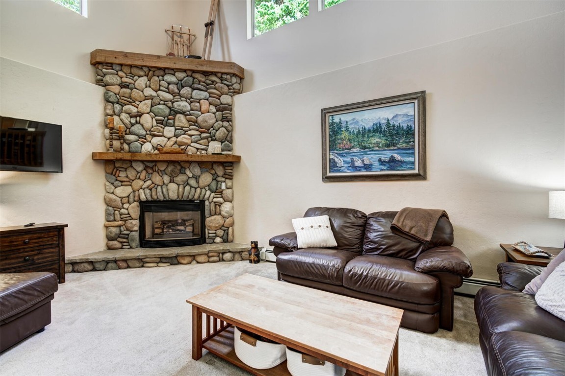 253 Blue Ridge Road Breckenridge, CO 80424 - Photo 10 of 33 Living room featuring a fireplace