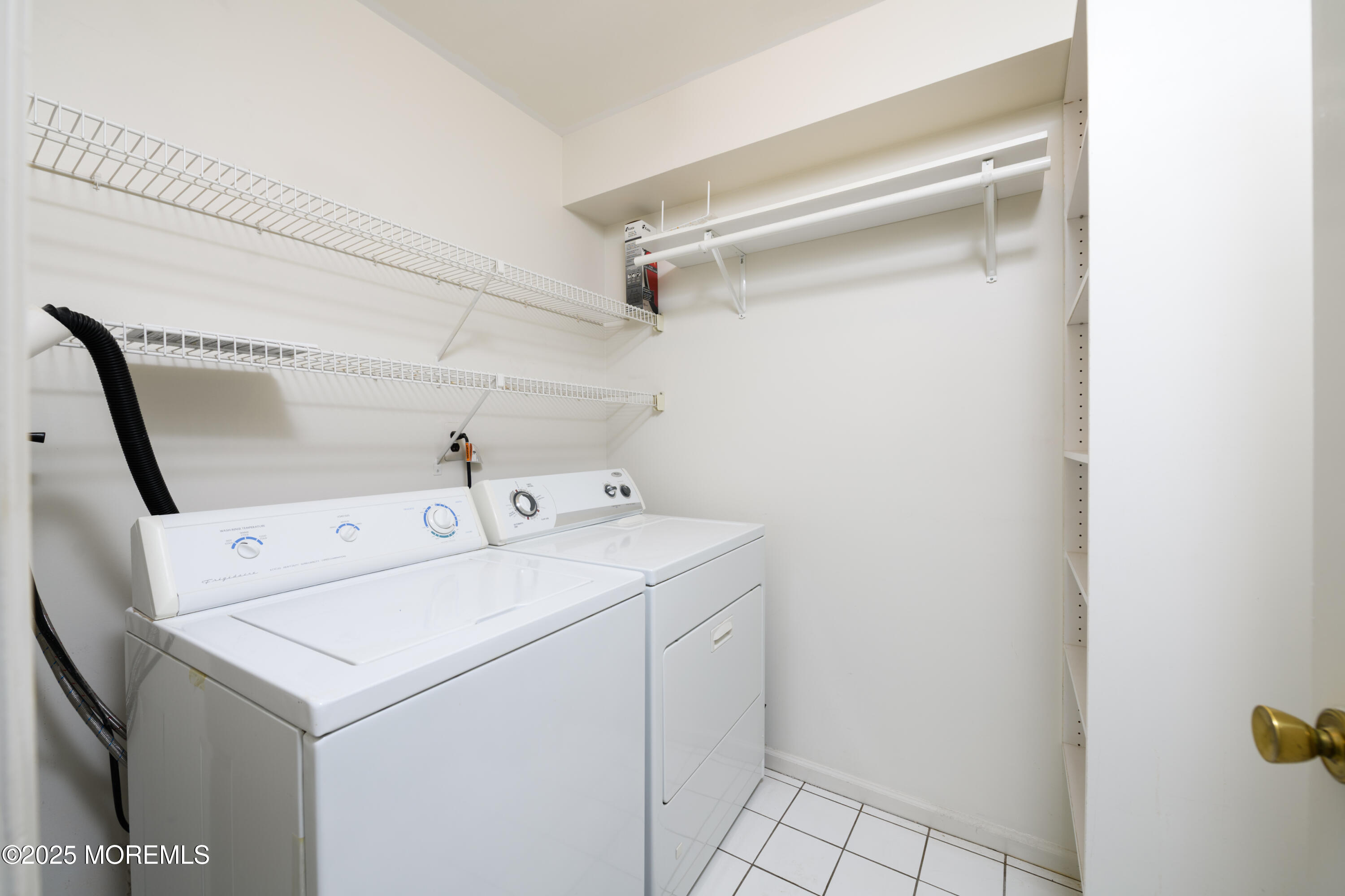 65 East River Road, Unit 14 Rumson, NJ 07760 - Photo 11 of 22 a utility room with dryer and washer