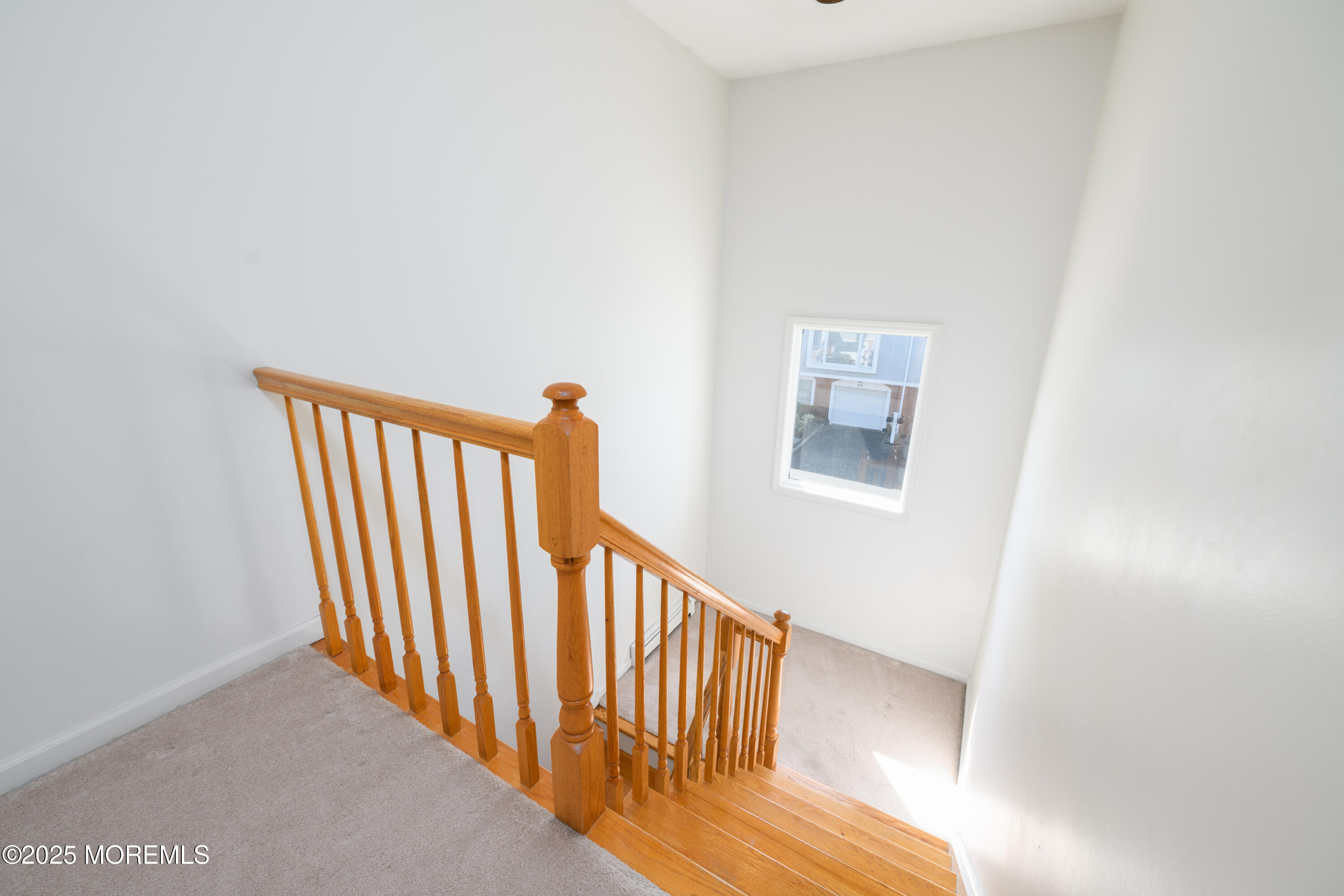65 East River Road, Unit 14 Rumson, NJ 07760 - Photo 15 of 22 a view of a hallway with staircase