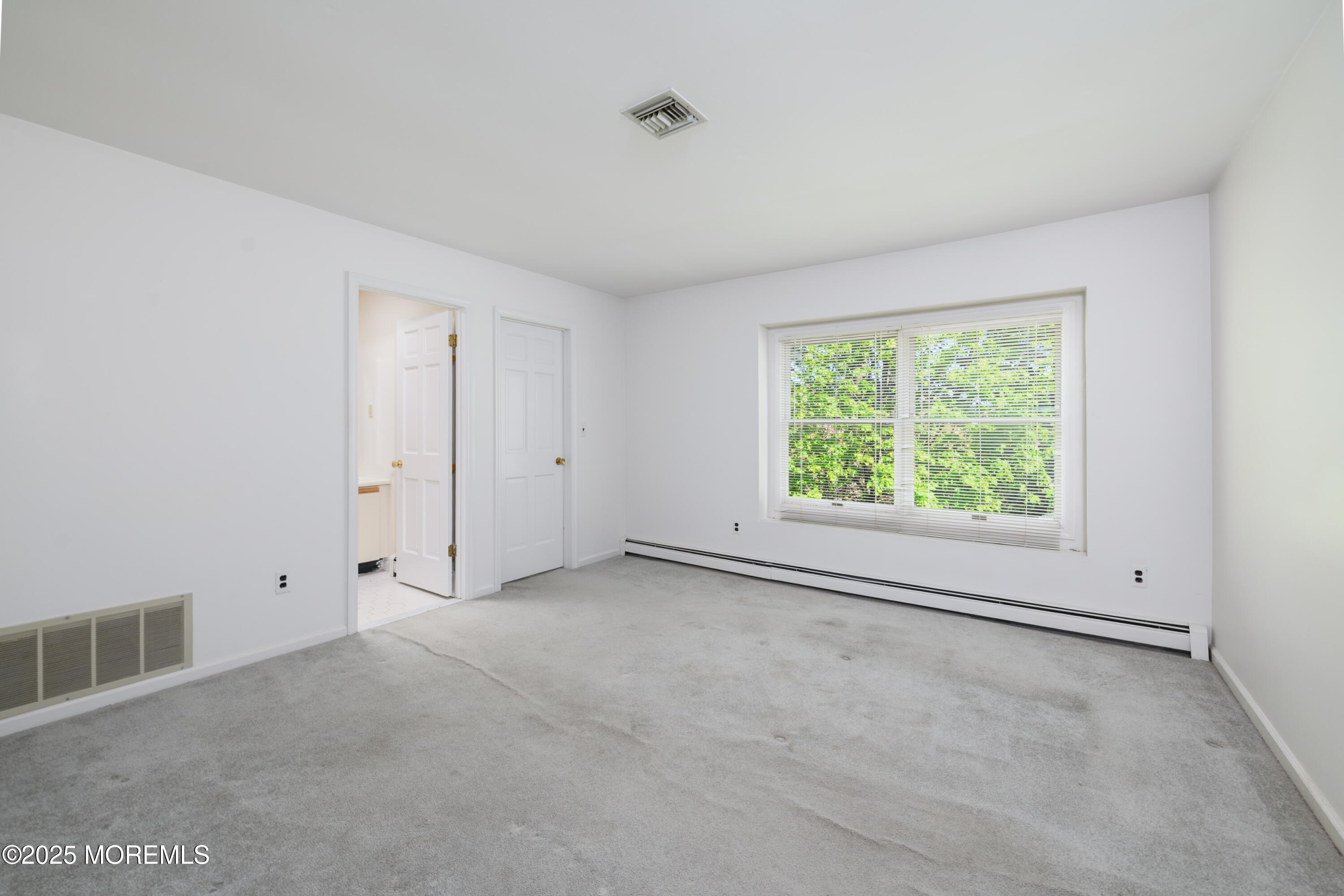 65 East River Road, Unit 14 Rumson, NJ 07760 - Photo 18 of 22 a view of an empty room with a window
