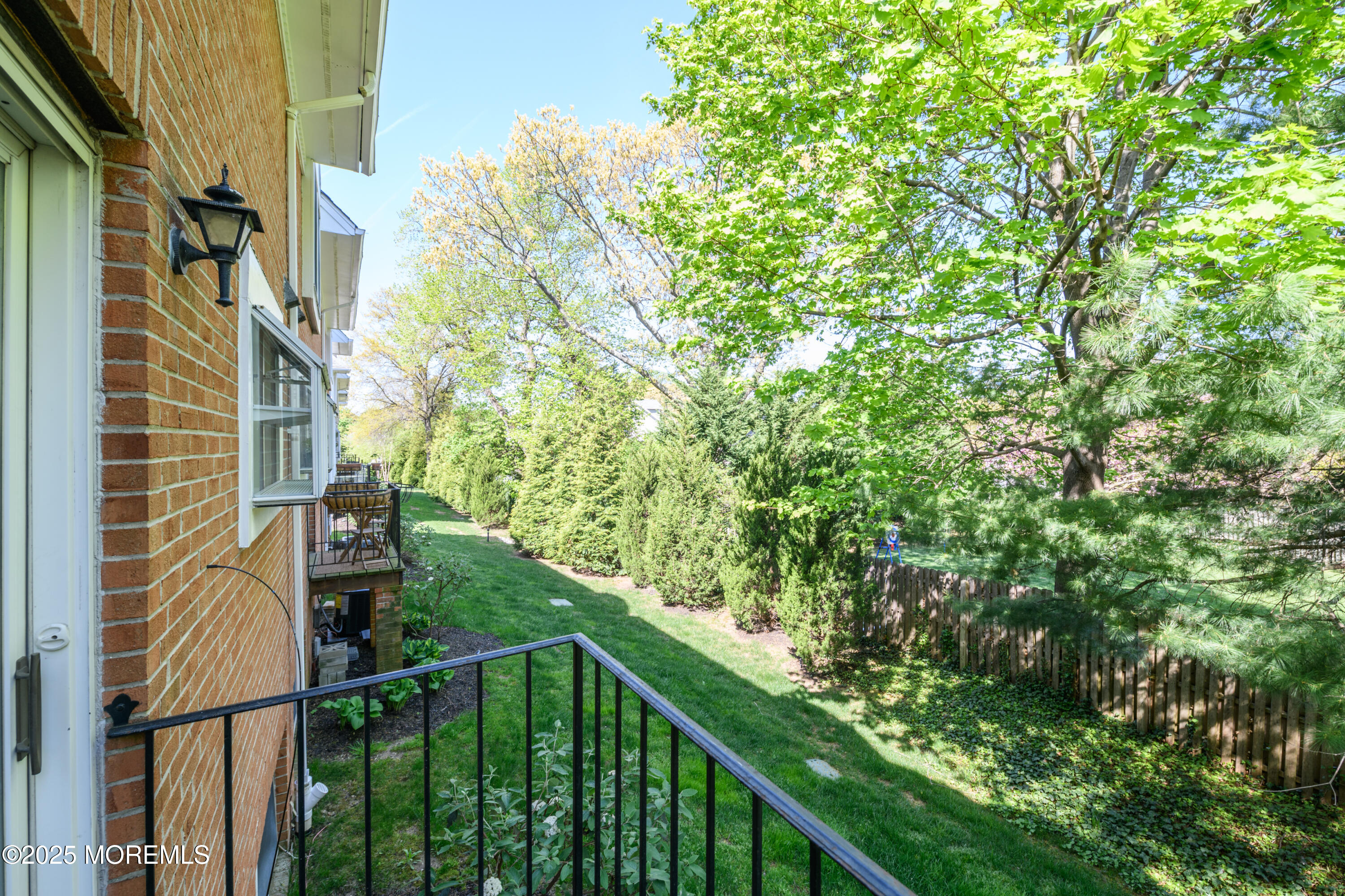 65 East River Road, Unit 14 Rumson, NJ 07760 - Photo 22 of 22 a view of a balcony with an outdoor space