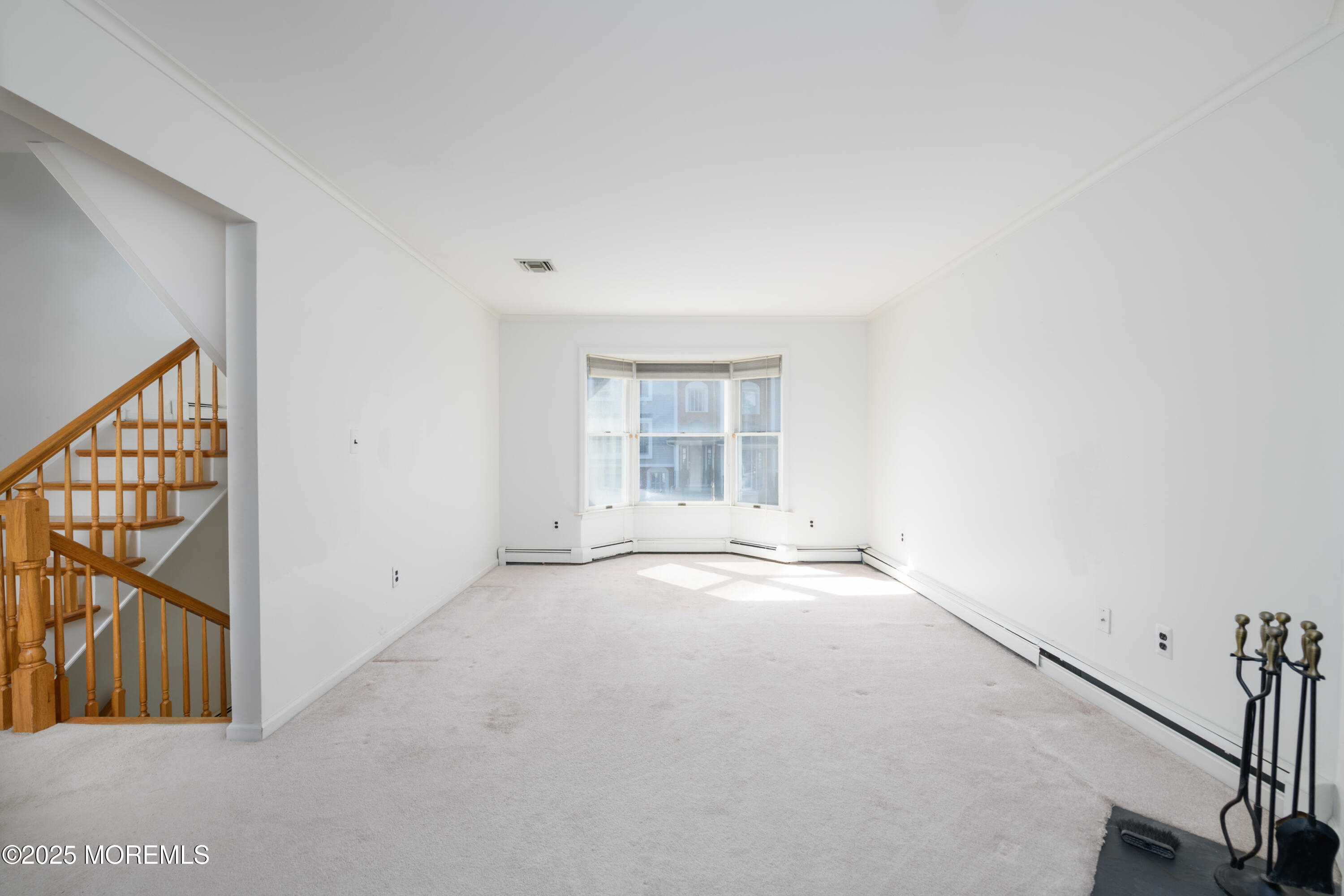 65 East River Road, Unit 14 Rumson, NJ 07760 - Photo 6 of 22 an empty room with windows
