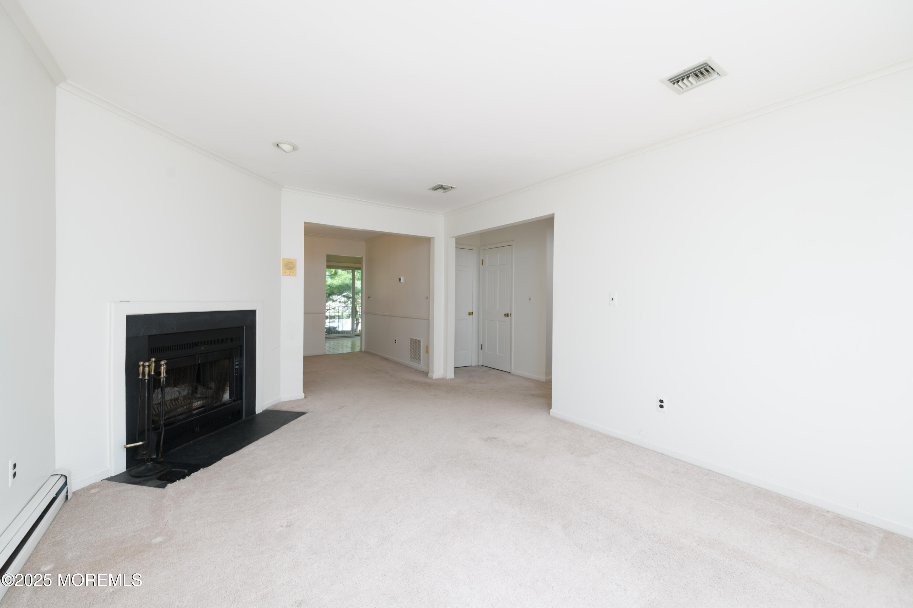 65 East River Road, Unit 14 Rumson, NJ 07760 - Photo 7 of 22 a view of empty room with a fireplace