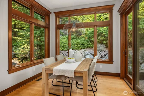 a dining room with furniture and windows