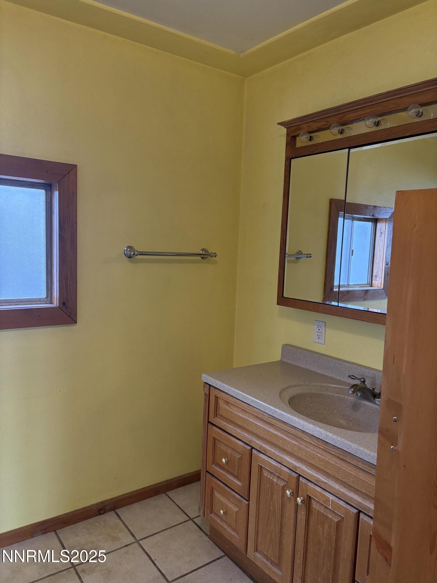 20 Miley Lane Yerington, NV 89447 - Photo 18 of 29 a bathroom with a sink and a mirror