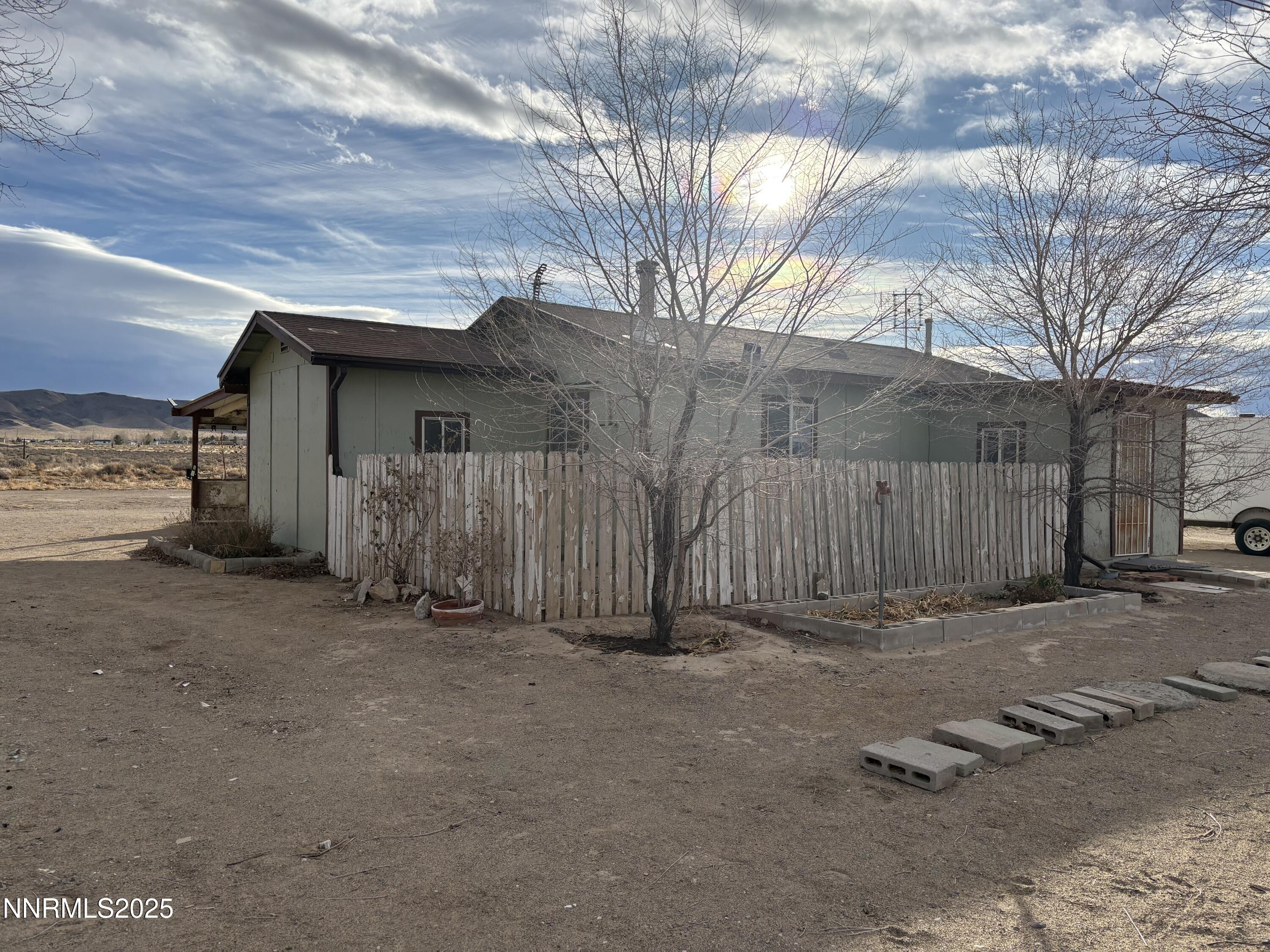 20 Miley Lane Yerington, NV 89447 - Photo 23 of 29 a view of a house with a wooden fence
