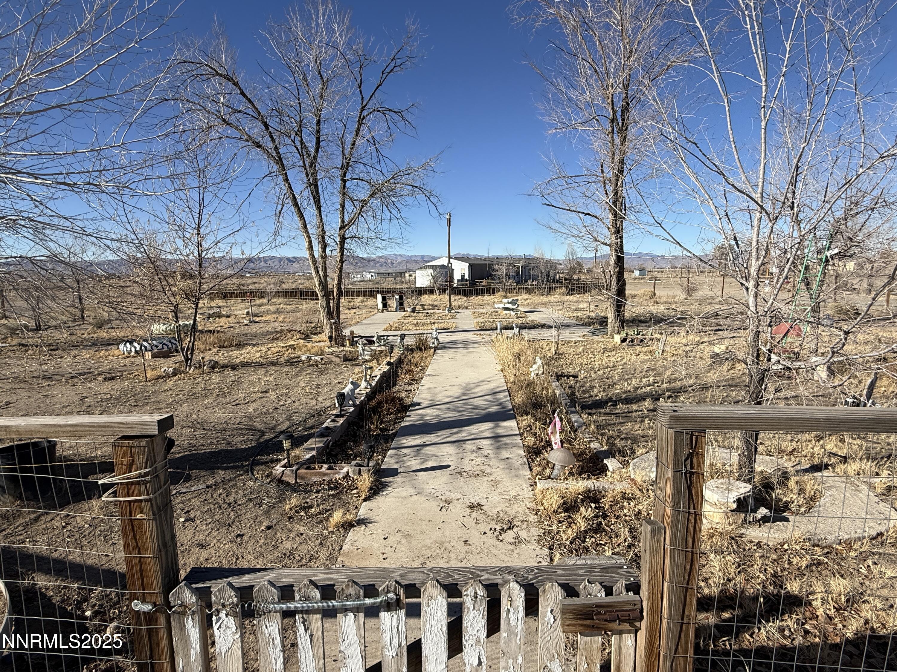 20 Miley Lane Yerington, NV 89447 - Photo 29 of 29 a view of a yard with wooden fence