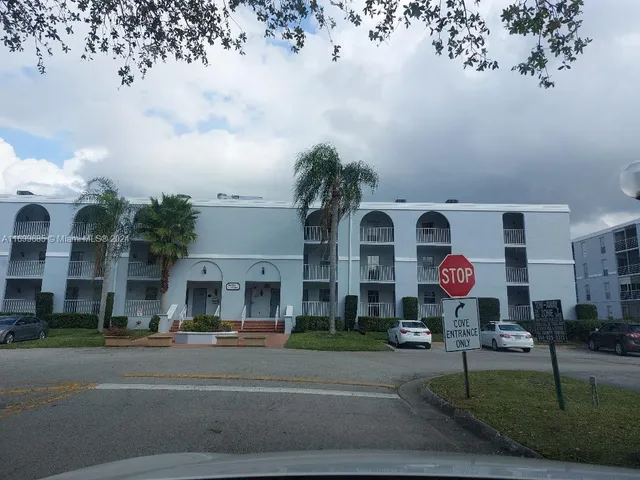 a view of a building with a yard