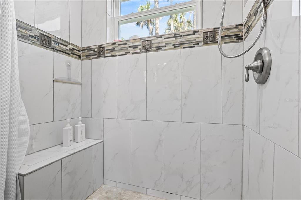 6244 Colony Circle Weeki Wachee, FL 34607 - Photo 49 of 60 a bathroom with a granite countertop sink a mirror and vanity