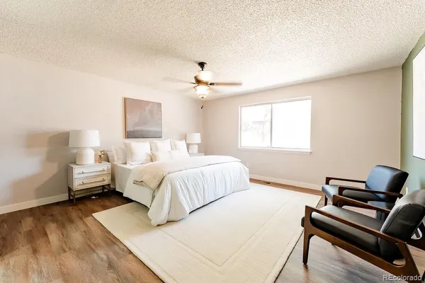 a bedroom with bed and a couch