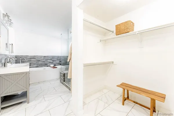 a bathroom with a bathtub and a sink