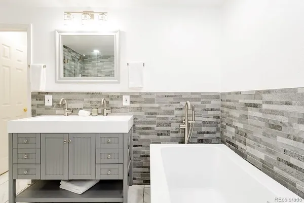 a view of a workspace with furniture and window